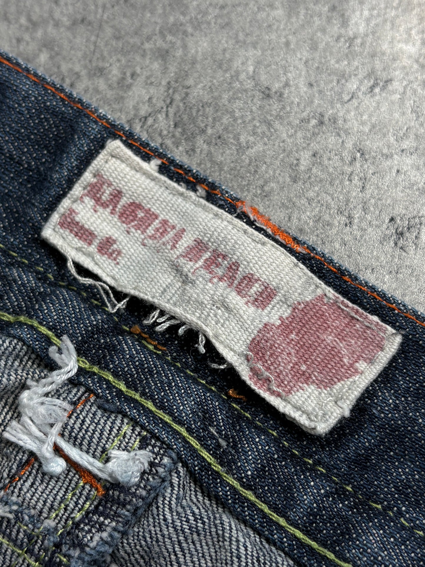 2000s Laguna Beach Chrome Tribal Skull Jeans