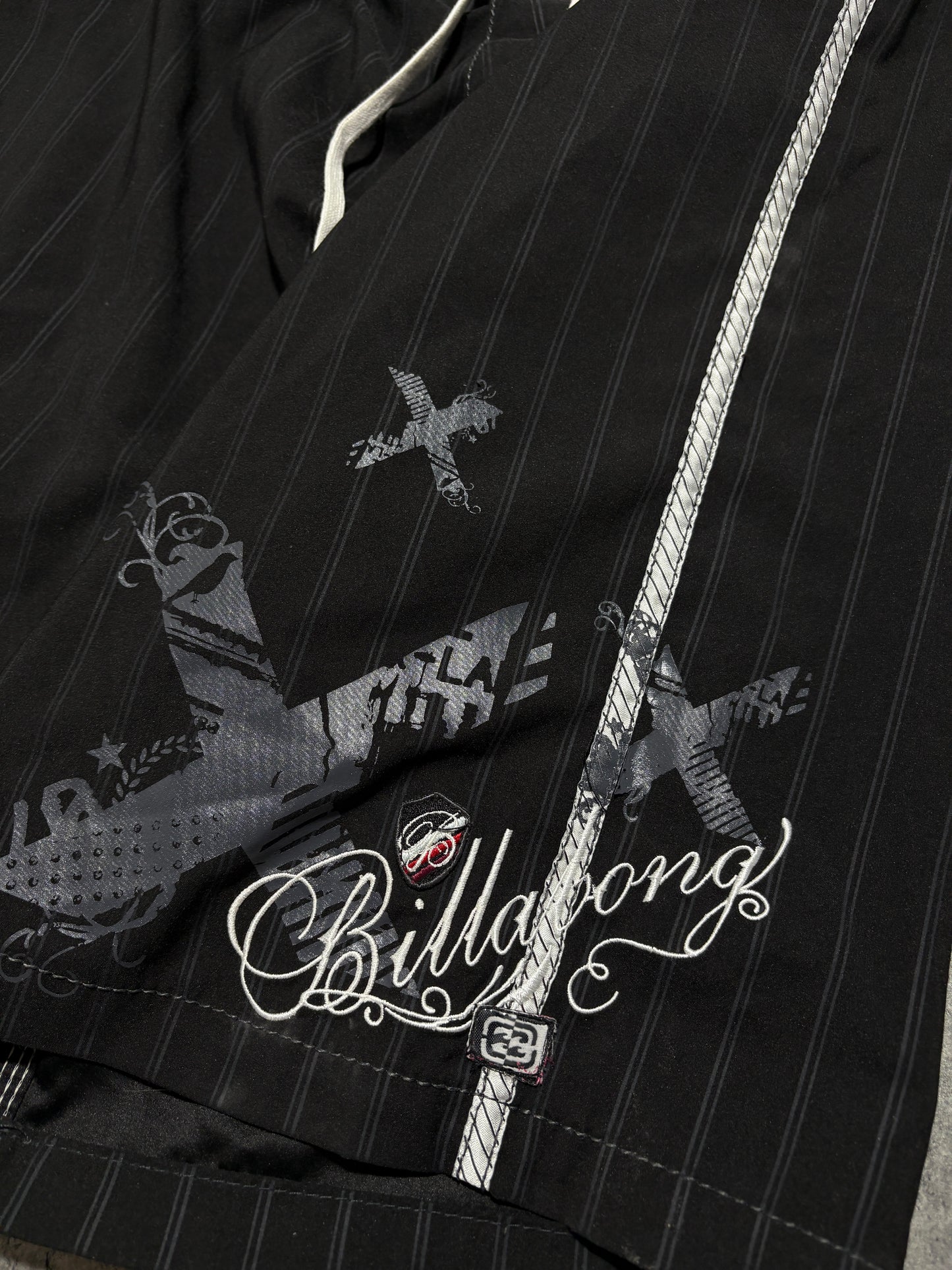2000s Billabong swim shorts black tribal