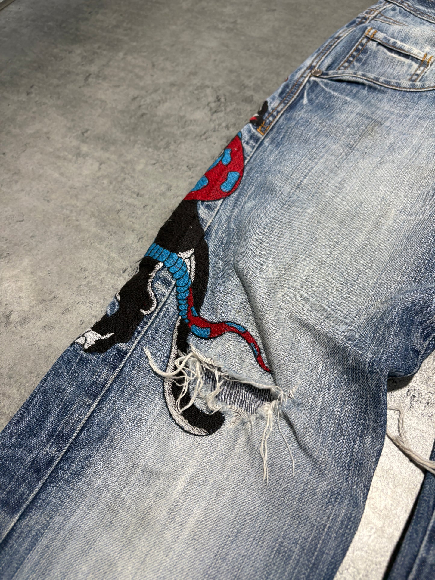 2000s distressed Rusty Neal embroidery jeans
