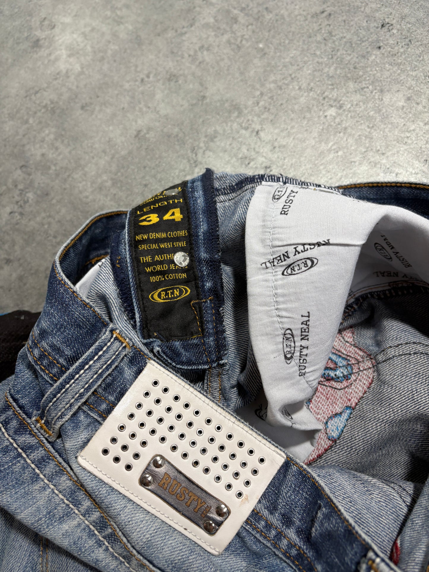2000s distressed Rusty Neal embroidery jeans