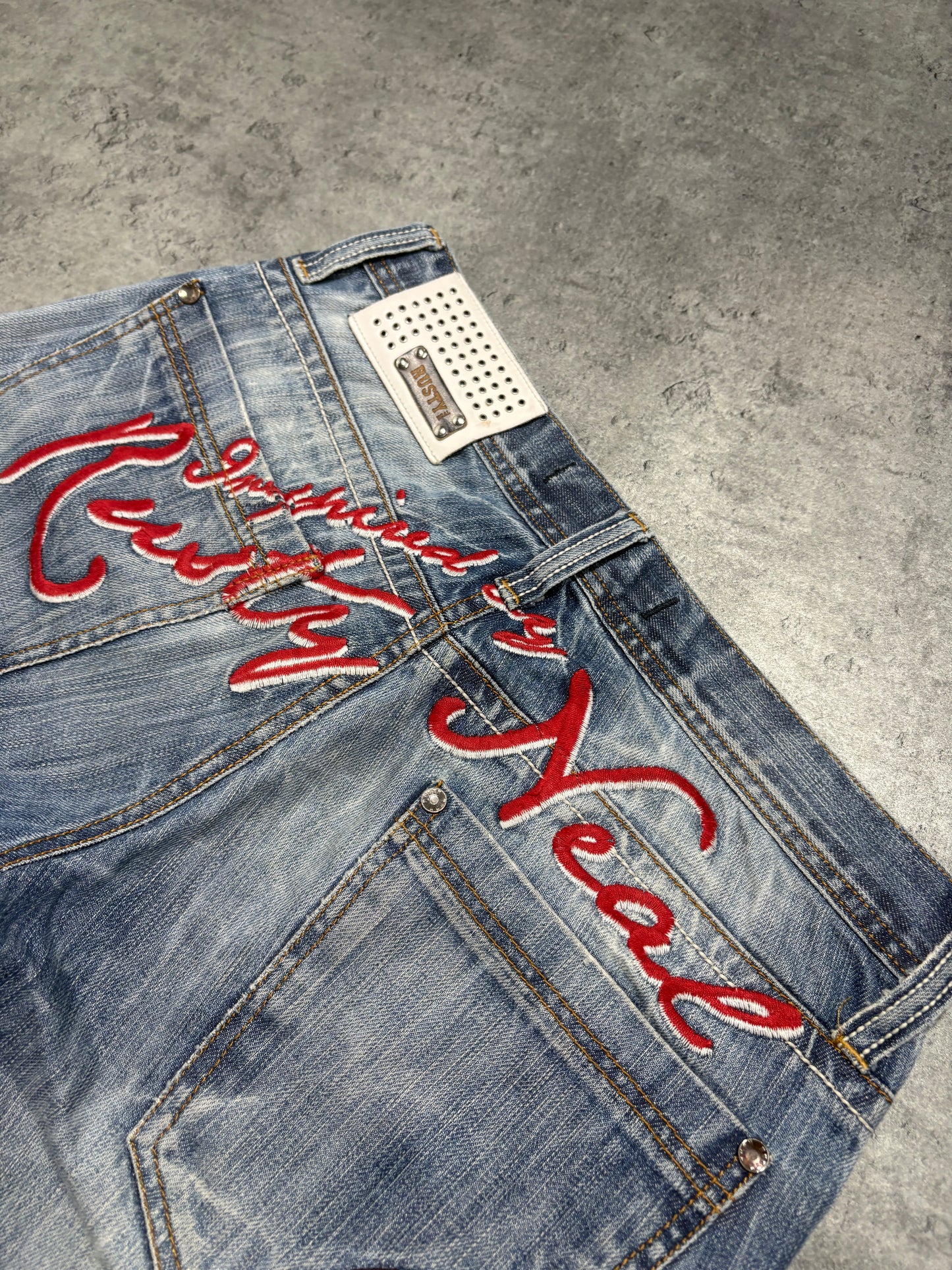 2000s distressed Rusty Neal embroidery jeans