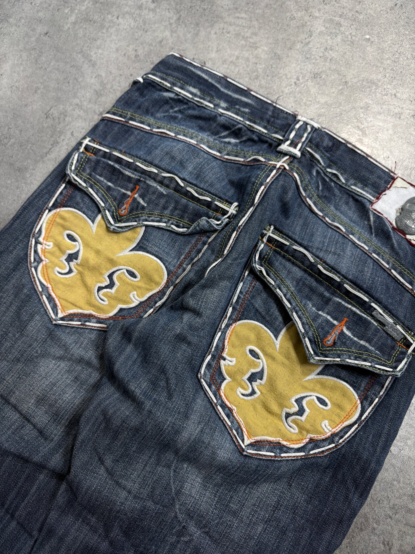 2000s Laguna Beach Chrome Tribal Skull Jeans