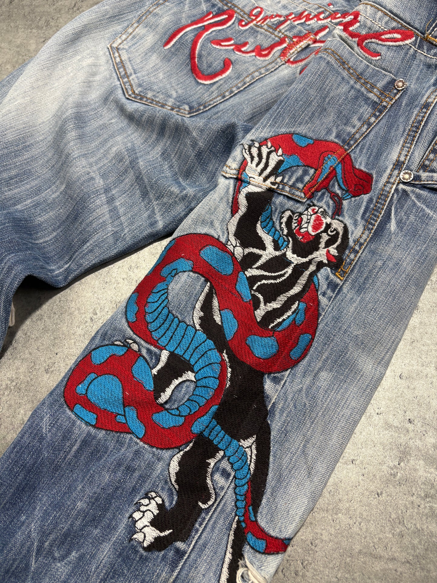 2000s distressed Rusty Neal embroidery jeans
