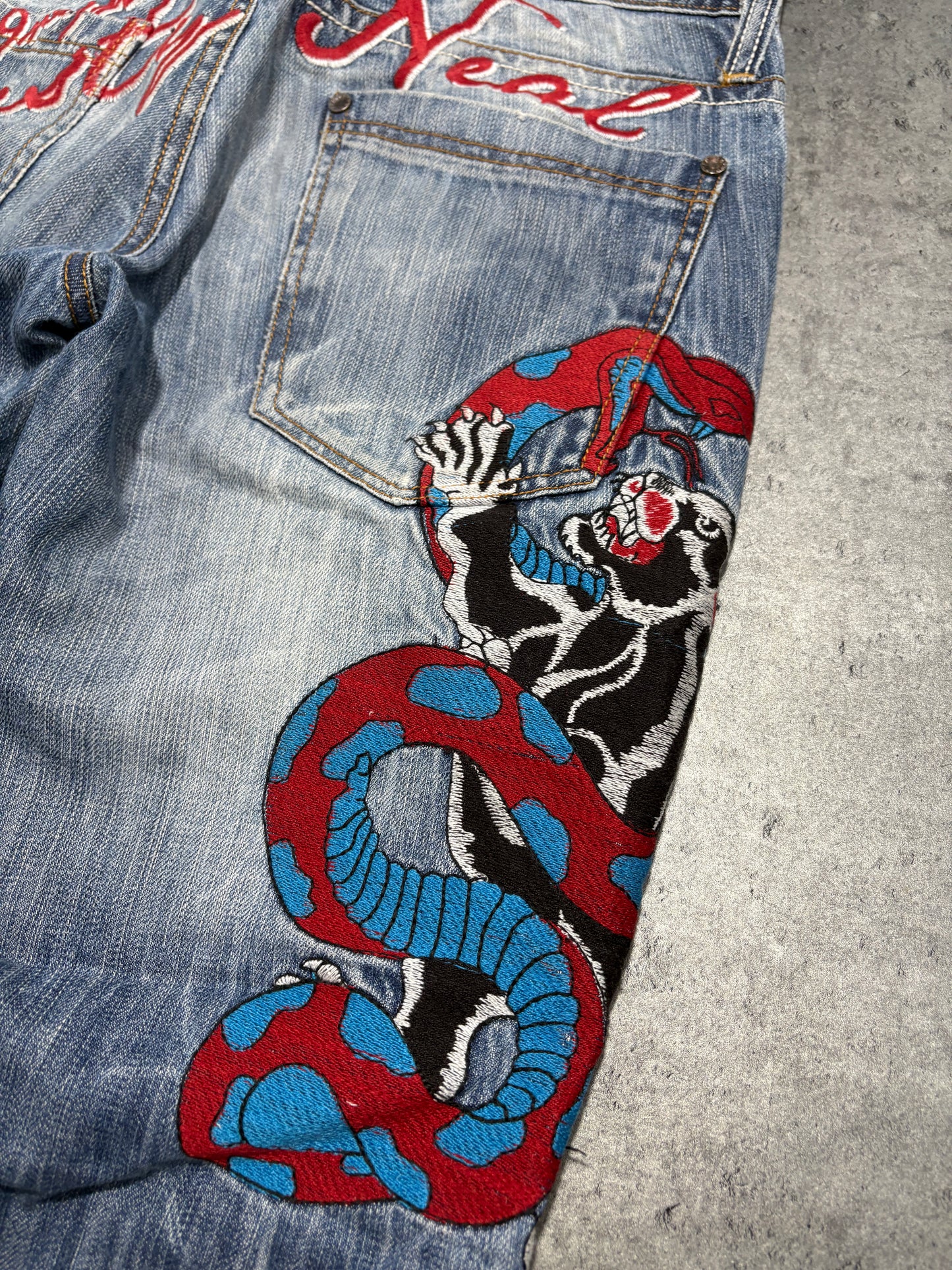 2000s distressed Rusty Neal embroidery jeans