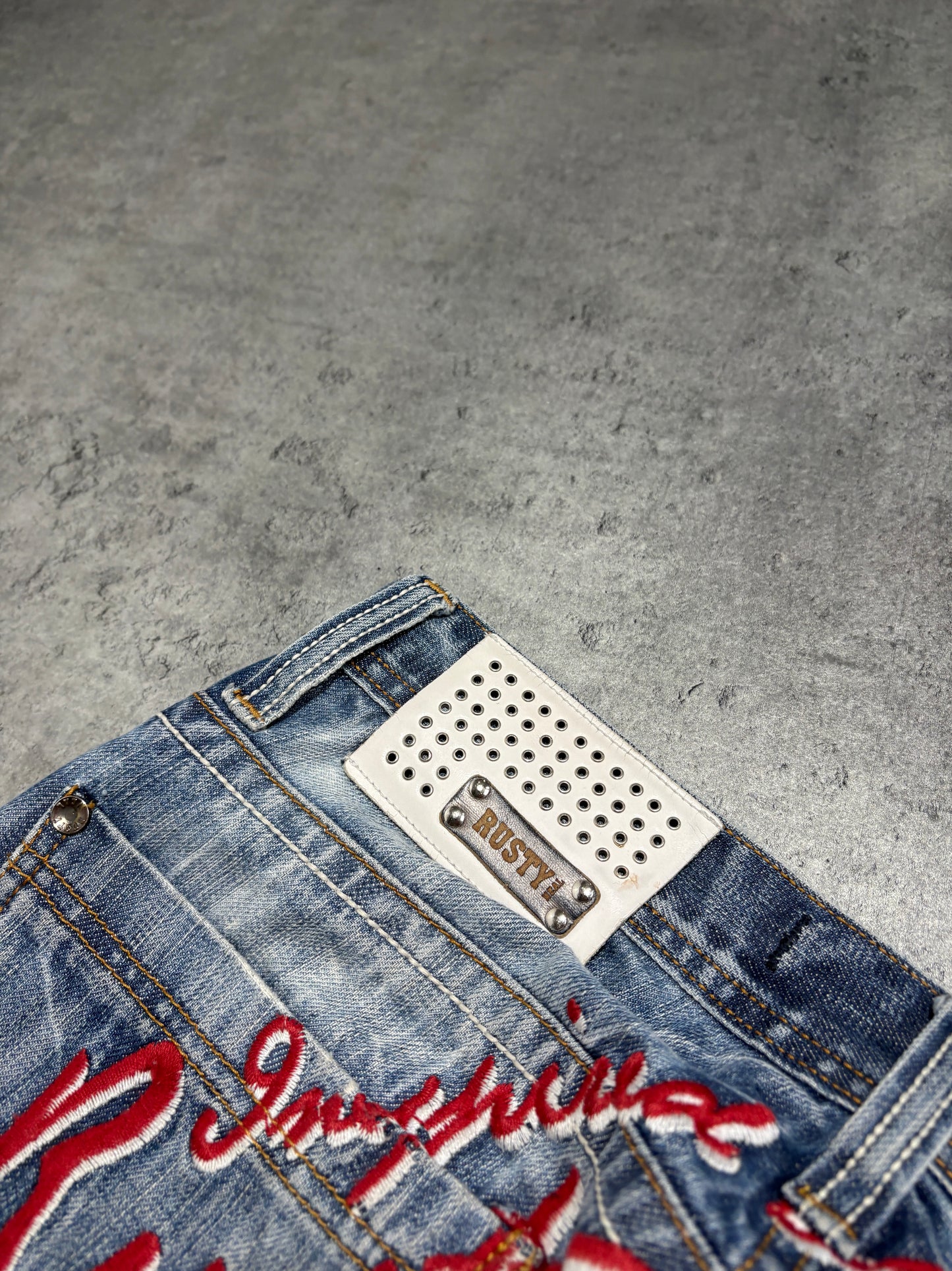 2000s distressed Rusty Neal embroidery jeans