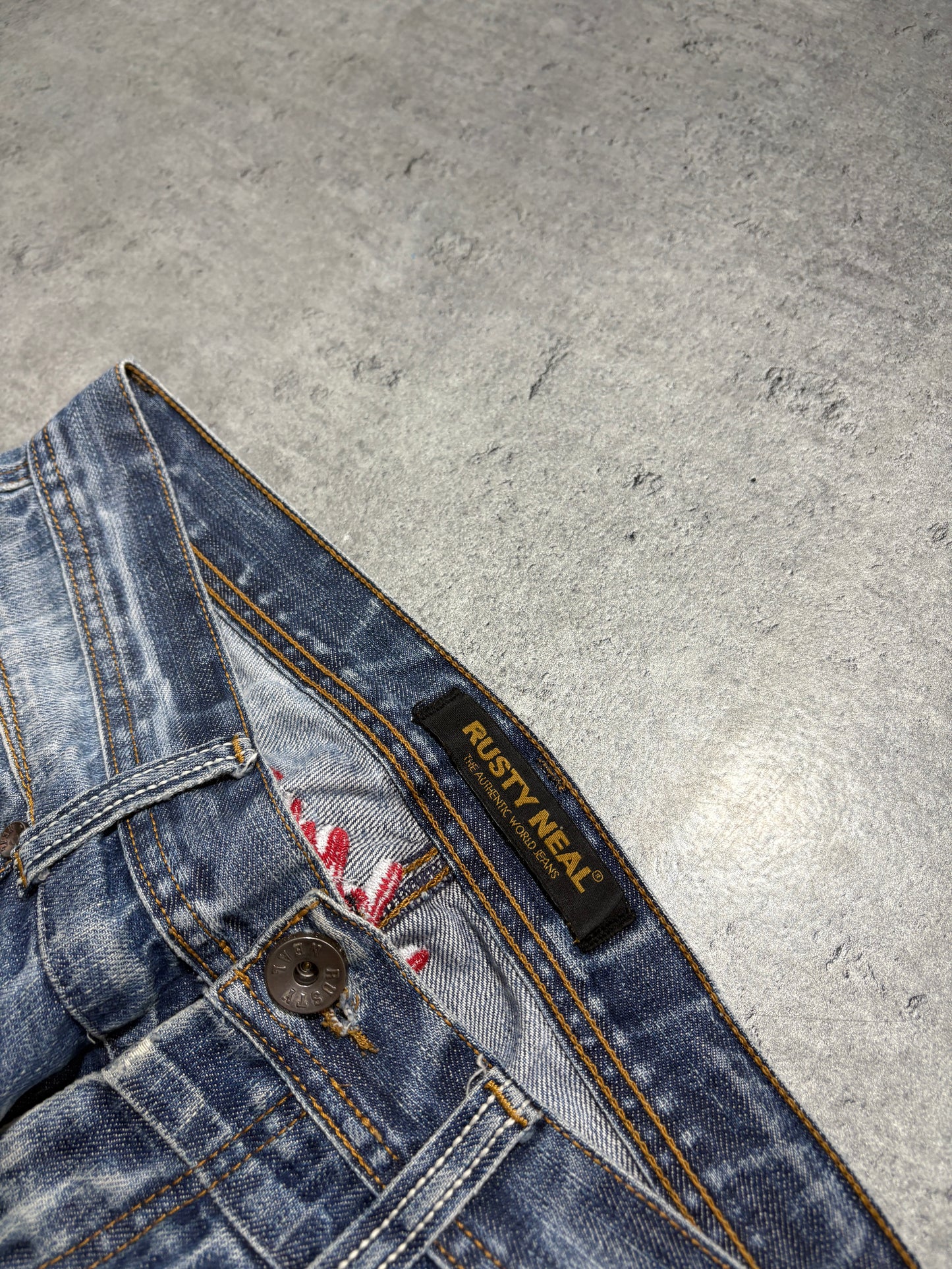 2000s distressed Rusty Neal embroidery jeans
