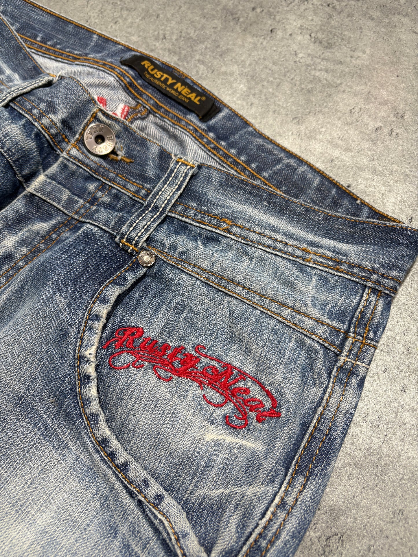 2000s distressed Rusty Neal embroidery jeans